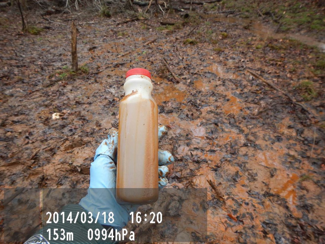 Dean Naujoks says this is a "seep" from the Duke Buck Steam Plant coal-ash pond leaching onto state game lands, directly into the Yadkin River. Testing by the Yadkin Riverkeeper indicates chromium at 10-times the groundwater standard, and lead at six-times the standard.