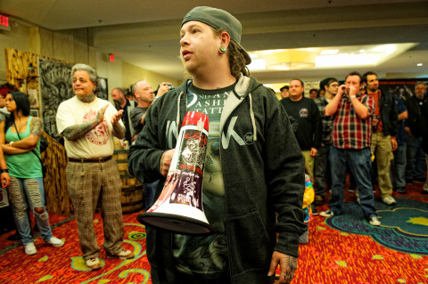 Local tattoo artist Daron James rallies the crowd at a previous tattoo convention. Photo by Micah McKenzie 