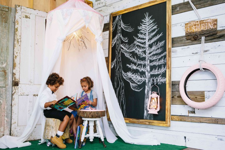 HAPPY CAMPERS: Moses and Lulu try out the kid's play tent, chalkboard and tea table from Hatchett Designs. Photo by Tim Robison