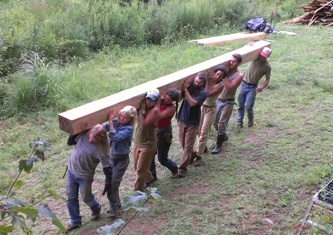 guys carrying big beam