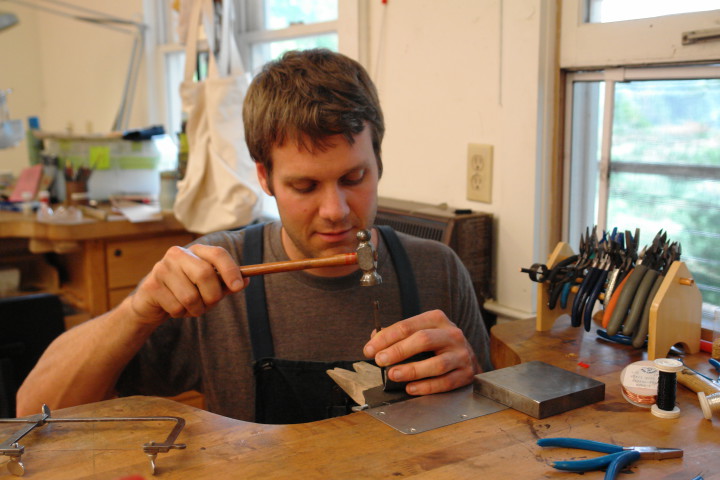 GEARING UP: Artist Ian Henderson tried his hand at clay but resonated with metal’s problem-solving aspects. His current pieces focus on mechanics and movement: "For me, there is simply joy in the bare-bones, analogue world of moving parts," he says. Photo by Betsy Dewitt