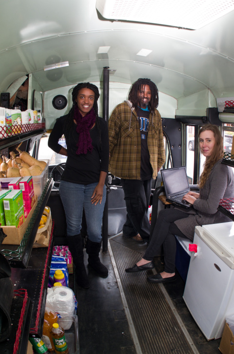 Pictured from left inside the Ujamaa Freedom Market Bus are Olufemi Lewis, Calvin Allen and Stephanie Freeman. Photo by Cindy Kunst