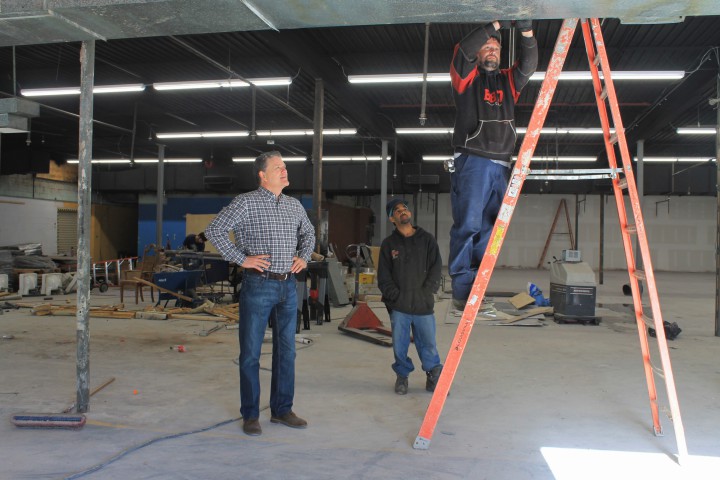 WORK IN PROGRESS: Charlie Ball, left, is pictured in the area of 45 S. French Broad Ave. that was formerly Downtown Market. The space will soon house an expanded Hopey & Co.