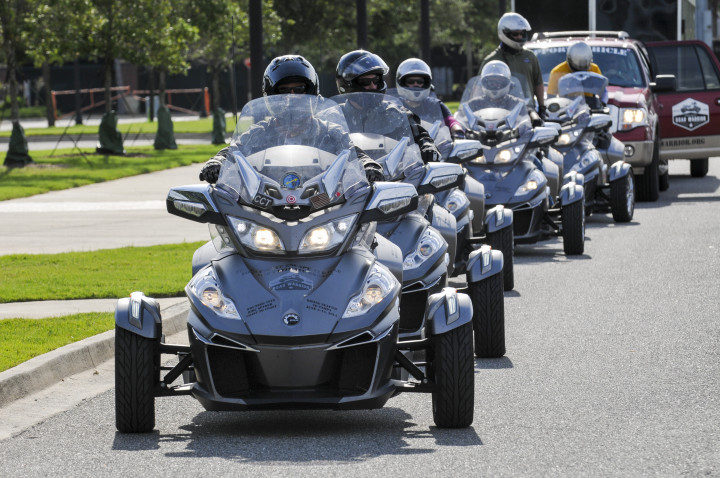 Members of the Project Road Warrior ride from Seattle, Washington to Tampa, Florida stopped at the Veterans Memorial Wall Friday, June 13, 2014 in Jacksonville, Florida. Six injured special operations veterans rode Can-Am Spyder three-wheelers on the 10-day journey that started in Seattle on June 5 and ended in Tampa June 14, 2014. Photo by Will Dickey