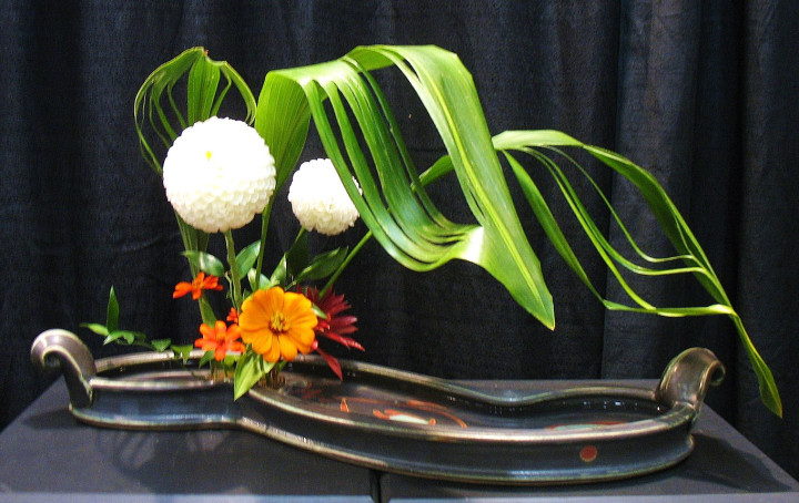 Free Form arrangement by Norma Bradley at the Southern Highland Craft Guild's Craft Fair, 2014. Container by Nick Joerling.