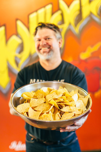 A HIGHER STANDARD: In opting to purchase mostly non-GMO and organic products for his restaurant — including only non-GMO corn chips and fryer oil — Mamacita’s owner John Atwater says he is trying to use his purchasing power to send a message. “The more interest we place on holding products up to a higher standard, I think that educates everyone, from the employees that work with us to the vendors that sell the products,” says Atwater.
