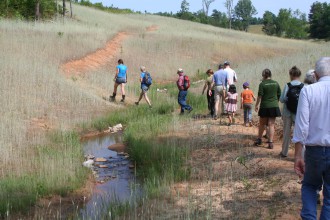 Events planned for June 6 include a 1.5 mile hike around SAHC's community farm in Alexander, NC. Photo via SAHC.