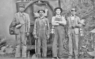 HAMMERS IN THE MOUNTAIN: Thousands of men, many of them convicts, blasted and bore their way through the Blue Ridge to bring the train to WNC. As industry moved on in the early 1900s, many families chose to follow the jobs west. Photo courtesy of Gerald Ledford.