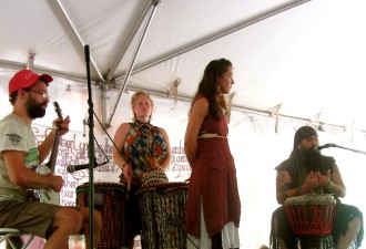 "Because many refuse to acknowledge that the Earth is a living, interrelated system and because many value some families and some lives over others and determine some ethnic groups as valuable, we remind them that the struggle of the Earth and the Struggle of the people are one," sang Jay Beck  (far right) part of musical group Carnival de Resistance. 