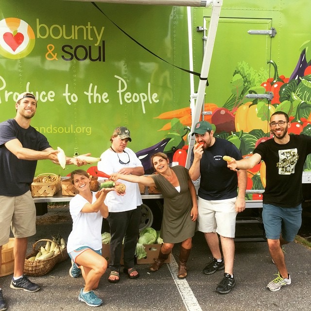 FRESH DELIVERY: Bounty & Soul founder Ali Casparian, third from right, is pictured with several of the organization's volunteers in front of their new mobile market truck. Volunteers use the truck to deliver fresh produce and offer cooking workshops in outlying areas surrounding Swannanoa and Black Mountain. Photo courtesy of Bounty & Soul