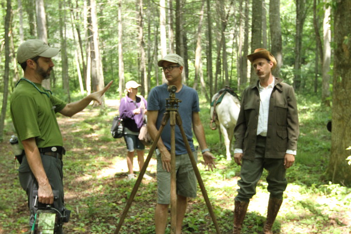 James Lewis, left, talks with director Paul Bonesteel, center, and "Dr. Schenck" about the action in an upcoming scene. Photo courtesy of Bonesteel Films.