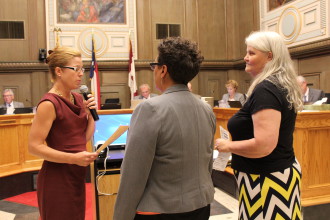 Mayor Manheimer declares Sept. 14-18 "Minority Enterprise Development Week"  with Sharon Oxendine and Jane Hatley. Photo by Virginia Daffron.