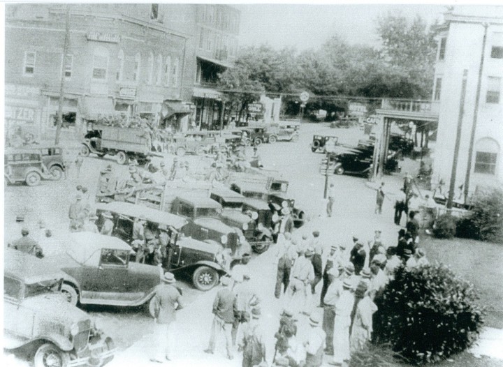 GATHERING STORM: National Guard troops roll through the sleepy town of Marion for deployment outside the Marion Manufacturing plant. Strife between workers and mill management would eventually boil over into violence in the early morning hours of Oct. 2, 1929. Photo courtesy of McDowell County Public Library, Warren Hobbs Collection.