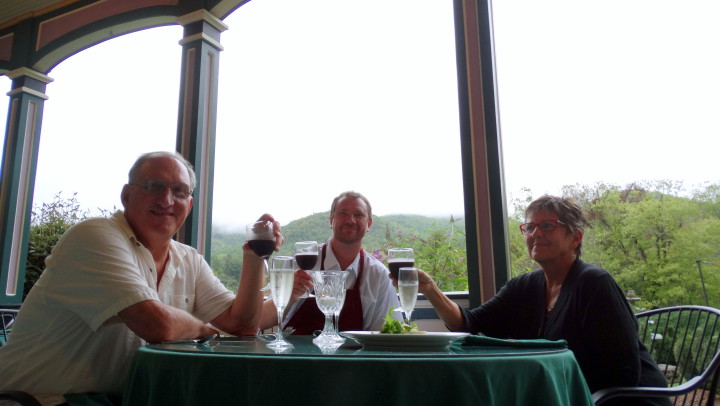 Mountain Magnolia Inn, Suites and Restaurant owners (Pete Nagle, left, Karen Nagle, right) raise a toast with executive chef, Zeb McDermott (middle). Photo by Krista L. White