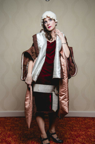 "High Society Flapper" $20. The burgundy dress and brown 20's coat are made from a velvet scarf and chair cover found in the Outlet bins. Modeled by Molly. Photo by Ken Lane 