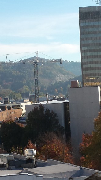 Construction crane facilitating the rise of Asheville AC Hotel. Photo by Julia Book