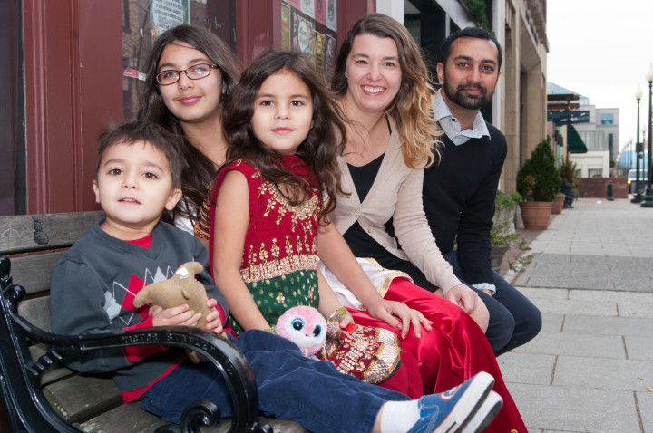CHRISTMAS CUSTOMS: Pakistan native Ephraim Dean, far right, celebrates an American-style Christmas with his wife, Wendy, second from right, and children, from left, Mikial, Neriya and Attia. Ephraim says he also attends midnight Christmas Eve church services to remind him of the traditions of his childhood. 