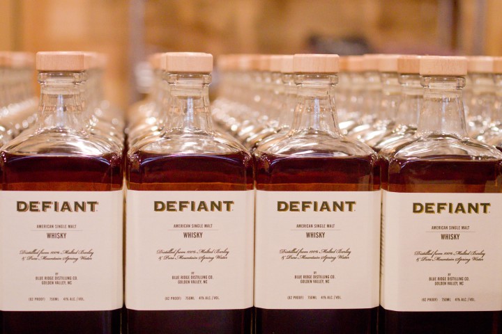 COMING OF AGE: Blue Ridge Distilling Co.'s Defiant single-malt whiskey and Carolina Distillery's Carriage House Apple Brandy are two brands of aged spirits made just outside the Asheville area that are becoming popular with bartenders at local craft cocktail spots.