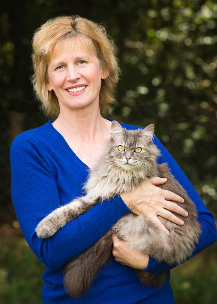 CREATURE COMFORT: Kristi King of Green Earth Pet Food holds her cat Dora. Photo by Sheryl Mann of Flying Dogs Photography