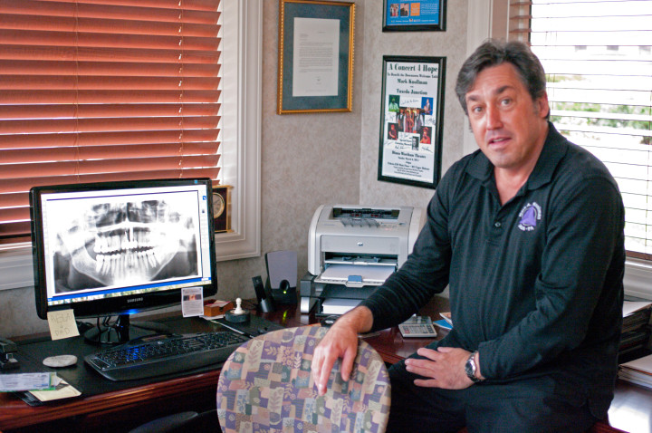 DOCTOR INSIDE: Dentist Mark Knollman puts patients in charge of their own dental needs. Photo by Cindy Kurst