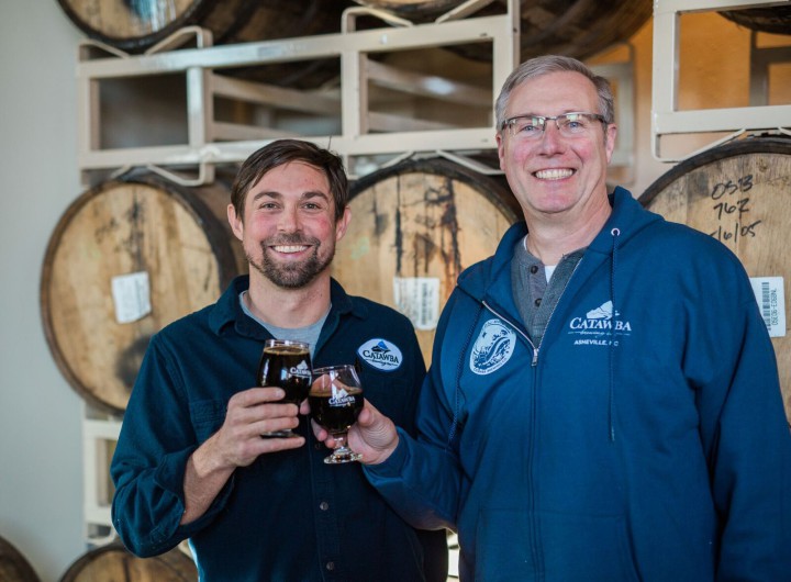 LOCK, STOCK AND BARREL: The rickhouse at Catawba Brewing Co.’s South Slope facility offers needed space for the brewery's barrel-aging program. Pictured is Shelton Steele, left, Catawba's director of commercial operations, with owner Billy Pyatt. 
