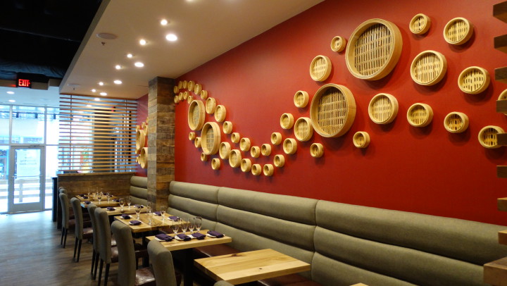 Traditional bamboo steamer baskets line the wall at the newly opened Red Ginger Dimsum & Tapas restaurant. (Photo by Krista L. White)