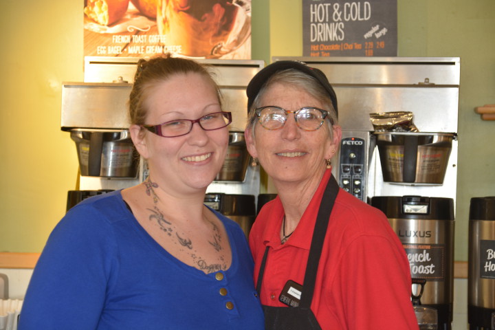 A FRESH START: “I think people deserve a second chance,” says Brueggers Bagels store manager Tammie Zimmerman, right, pictured with Changing Together participant Olivia Hensley, now a shift manager at Brueggers Bagels. Photo by Leslie Boyd