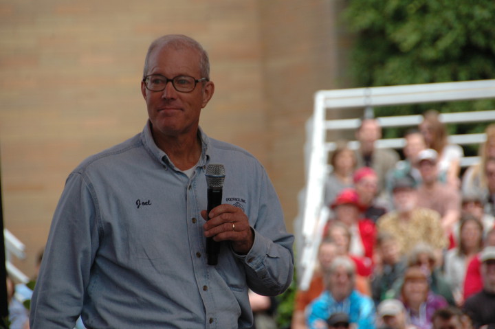 Joel Salatin, author of "Folks, This Ain’t Normal," and other titles, addresses a crowd at a Mother Earth News Fair. Photo by Bryan Welch  