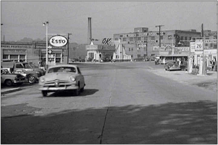 Chase scene with the gray ’50 Ford coupe shot in what is now the River Arts District. Photo courtesy of Park Circus