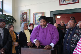 Isaac Coleman, right, with Rev. Dr. William Barber, head of the North Carolina NAACP in Asheville in January. Photo by Virginia Daffron