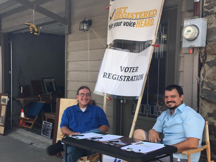 Members of the Buncombe County Libertarian Party work a voter registration booth at Black Mountain's Sourwood Festival. As of Aug. 20, the Libertarian Party had  