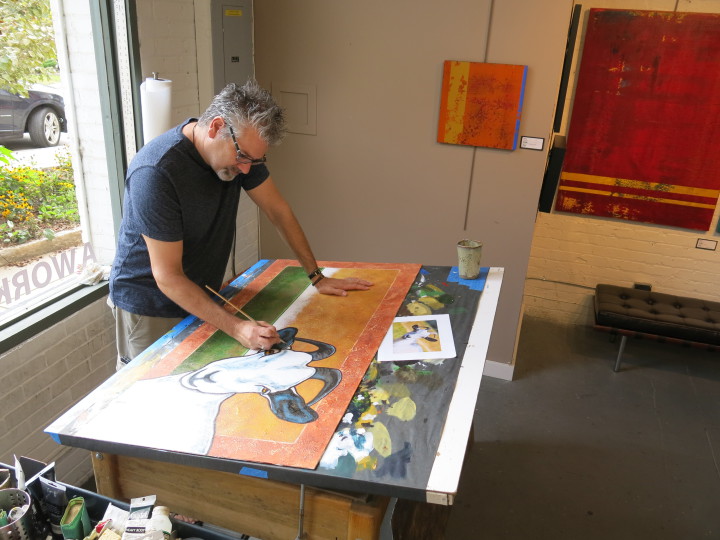ARTIST AT WORK: Phil DeAngelo works on a piece at Broken Road Studio, in the Wedge building. Photo by Thomas Calder 