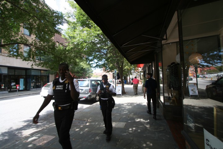 Secret Service agents, in uniform and plain clothes, are walking the streets of downtown Asheville. Photo by Dan Hesse