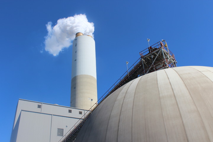 The gypsum storage structure (right) holds material extracted from by the scrubber unit that removes contaminants from vapor before it is released from the plant's smokestack. Photo by Virginia Daffron