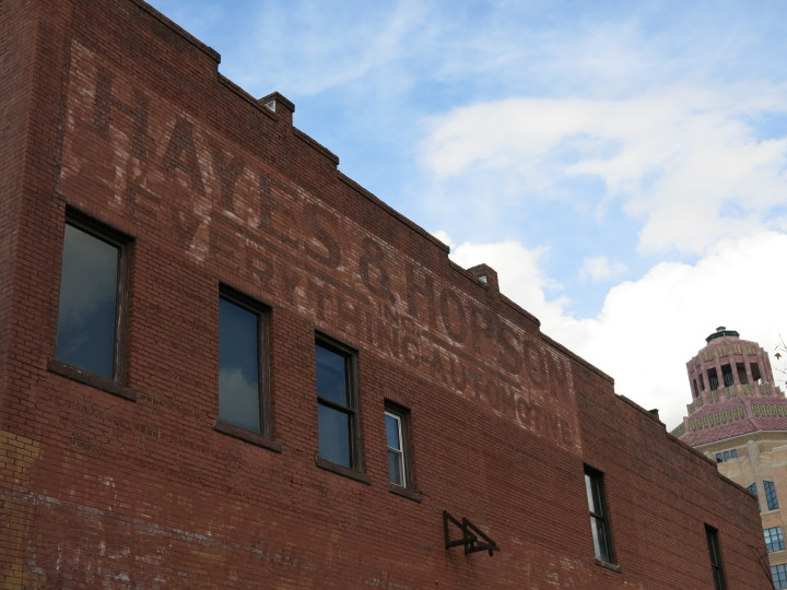 HAYES & HOPSON: The fading ghost sign on the south wall of Pack Tavern. Photo by Thomas Calder