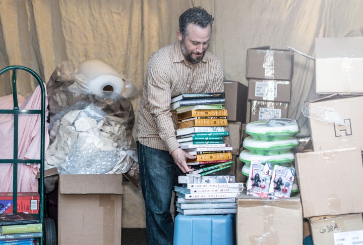 DELIVERYMAN BY DAY, BOOK DEALER BY NIGHT: Lev Habif keeps busy working for FedEx and running his own online business. Photo by Celia Tabitha Photography 