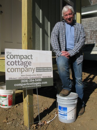 COTTAGE SWEET COTTAGE: Barry Bialik stands outside a house that his Skyland-based Compact Cottage Company is building in Asheville's Kenilworth neighborhood. Bialik chairs the city’s Affordable Housing Advisory Committee. Photo by Mike Cronin