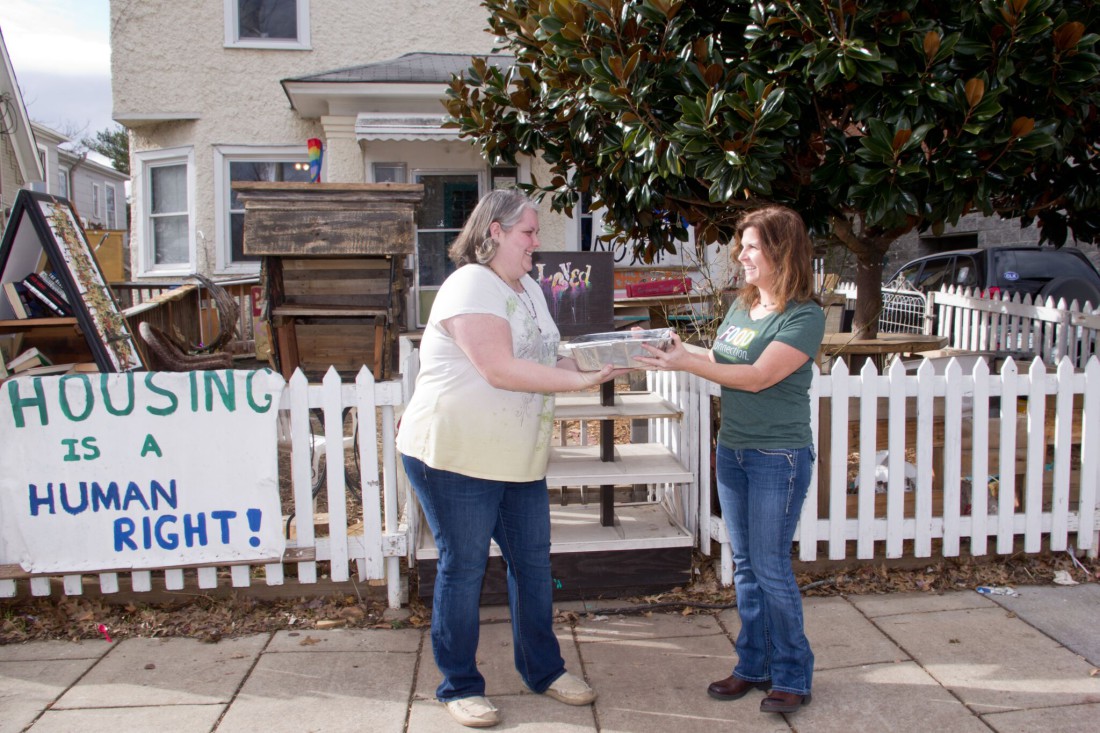 WASTE NOT: Food Connection founder Flori Pate, right, delivers a container of fresh food to Adrienne Sigmon at BeLoved House. Food Connection takes advantage of the Bill Emerson Good Samaritan Food Donation Act to transfer high-quality, untouched food that would otherwise be thrown away to organizations that can distribute it to those in need.