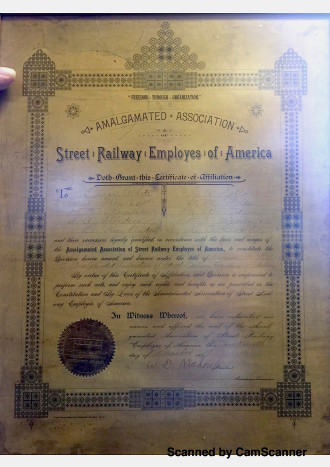 FOUNDING DOCUMENTS: The original charter of the Amalgamated Transit Union 128, on display at their office. Retired International VP of ATU Gary Rauen says that in addition to serving their members, ATU 128 serves as “the eyes of the community” for bus safety and cleanliness. Photo courtesy of ATU 128