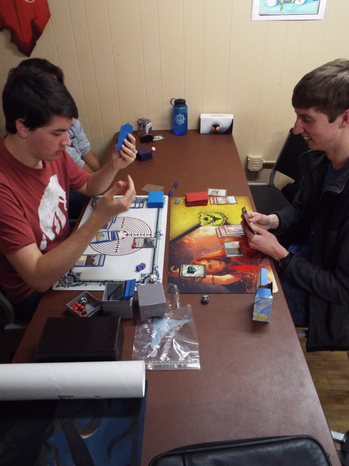MAGIC IN ME: Nic Sarbaum and Matthew Campbell battle to the death as opposing wizards, summoning creatures and casting spells to aid them in the popular card game Magic: The Gathering at a Friday Night Magic tournament hosted by Gamers Haunt. Photo by Able Allen