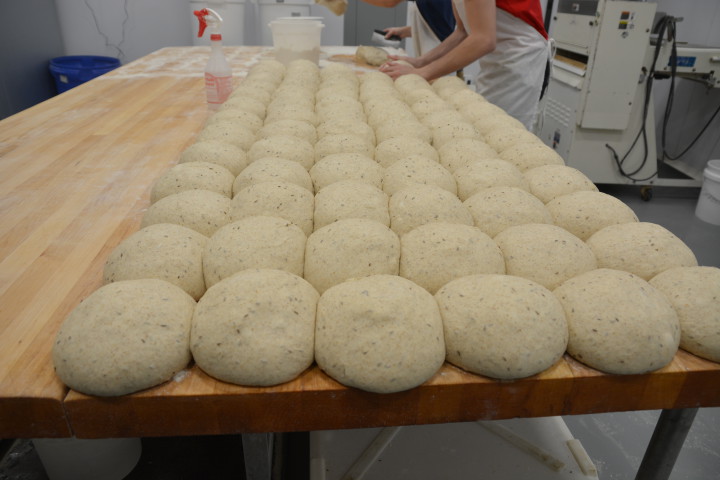 LOCAL LOAVES: Loaves of whole-wheat bread are about to go into the oven at City Bakery.