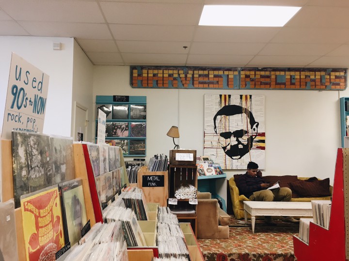 LISTENING ROOM: Harvest Records has more than records —  There are also CDs, posters and a comfy couch area to read and share with fellow music lovers.