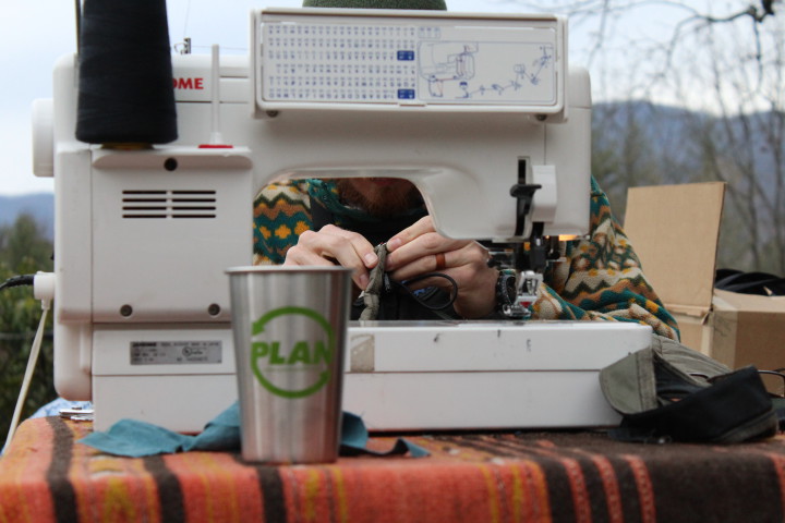 Patagonia's sewing tech, Austin Stubbs, focuses on stitching during the "Worn Wear College Tour" stop at Warren Wilson College. Photo by Kari Barrows