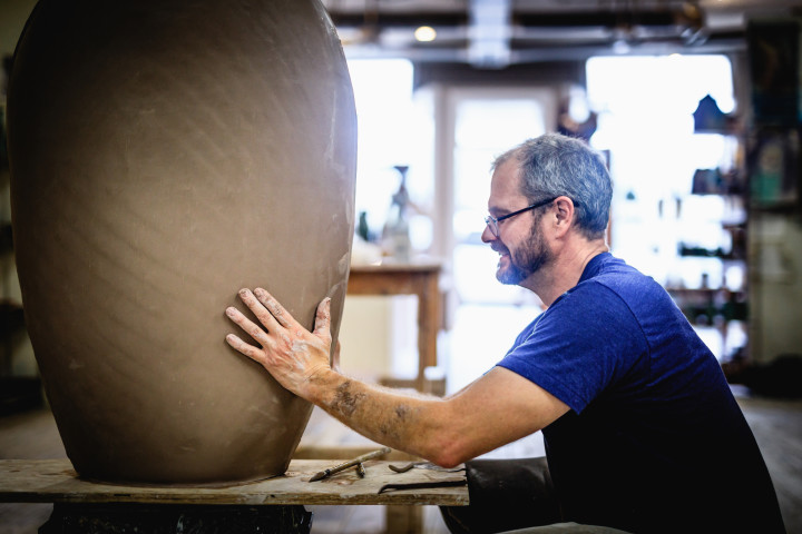 KINFOLK CRAFTS: Rob Mangum moved to Asheville in 1997 to continue a creative tradition started by his parents 30 years earlier. His studio, Magnum Pottery, owned with his wife, is located in Weaverville. Photo by Nathan Chesky