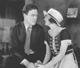 Thomas Meighan and Doris Kenyan in April 1921 filming "Conquest of Canaan." The scene takes place in Joe Loudon's office, located at Famous Players-Lasky's New York Studio.