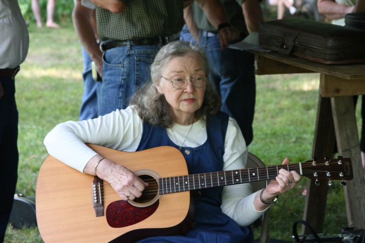 JUST FOLKS: Ballad singer Betty Smith is one of the Bluff Mountain Festival’s original organizers. In 1996, she used vocals and guitar riffs to save Madison County’s treasured peak. Photo by Pat Franklin