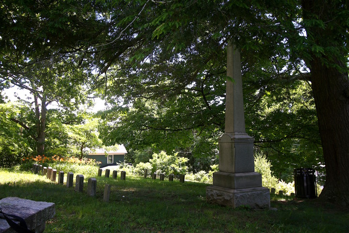 COMPETING NARRATIVES: The Confederate monument and memorial gravestones at Asheville's historic Newton Cemetery (above), stand prominently among the resting place of Asheville's earliest white settlers. By comparison, the markers to local Union soldiers are smaller and discreet. Photo by Max Hunt