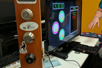 In addition to the presentations, the 2017 Asheville Bsides conference will feature workshop events, like the lockpicking station (above), and chances to network with other IT professionals and business entrepreneurs from the region. Photo by Timothy de Block; courtesy of Asheville Bsides