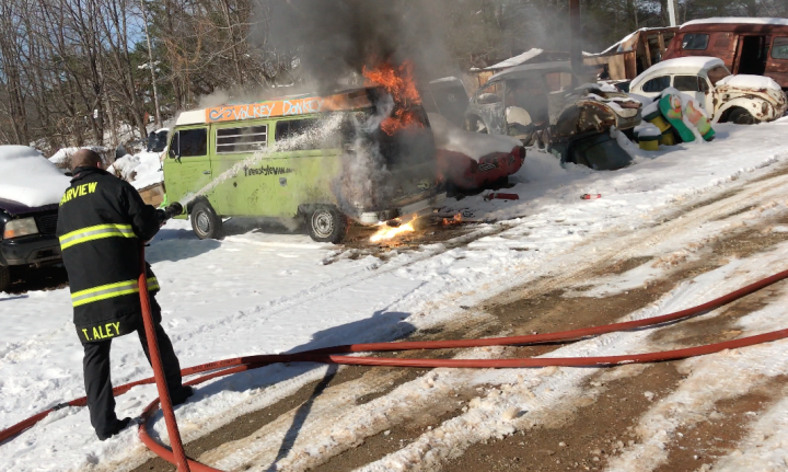 UP IN FLAMES: A firefighter with the Fairview Fire Department douses the flames on Hokey Pokey’s van, which contained all of the owner’s possessions. Yet the setback has not dimmed the writer’s affection for van life. Photo by Hokey Pokey