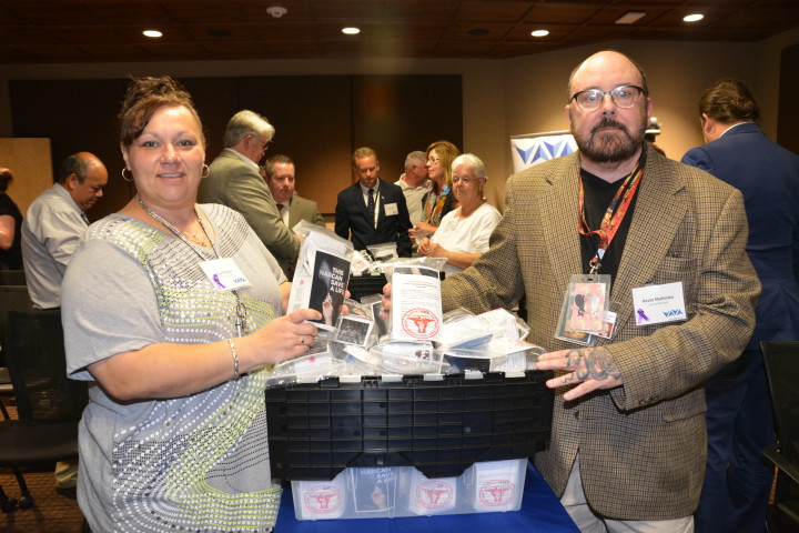 Sue Poston and Kevin Mahoney, of Sunshine Community, with some of the 2,400 Narcan packets that will be distributed in Western North Carolina. Each bag contains two doses of Narcan and information on how to get treatment for addiction. 